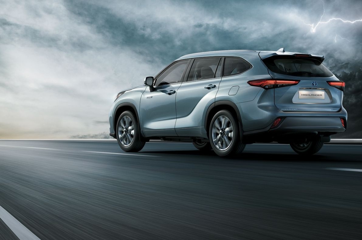 Toyota Highlander rear three-quarter view driving on road