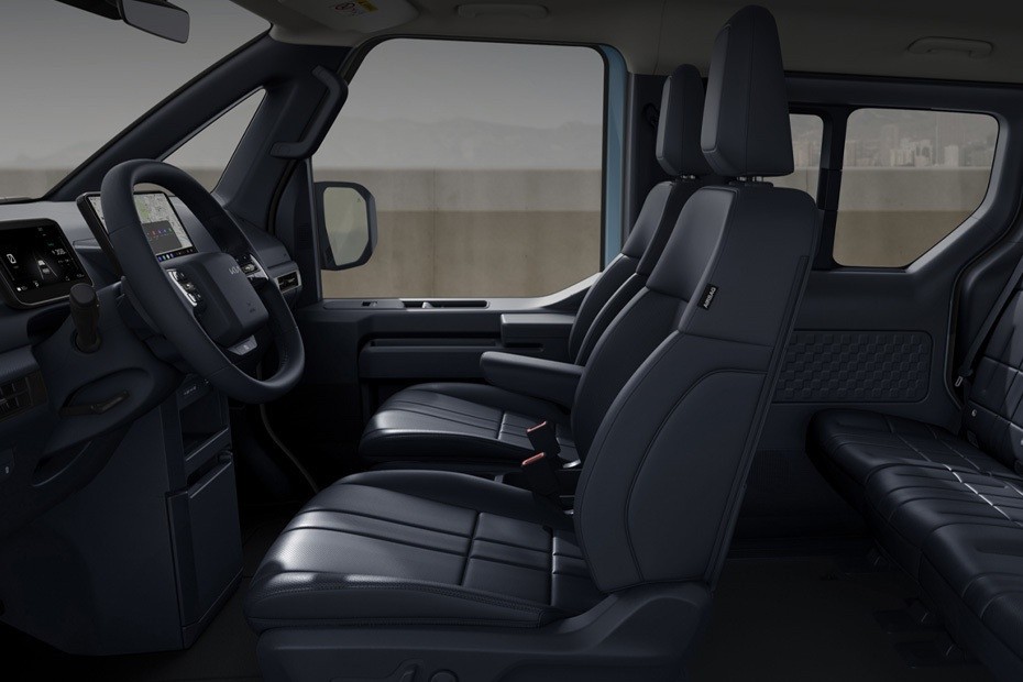 Kia PV5 interior front seats with spacious cabin design